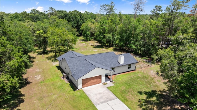 2455 Whooping Crane Dr, De Leon Springs, FL 32130 - view of subject property with a heavily wooded area