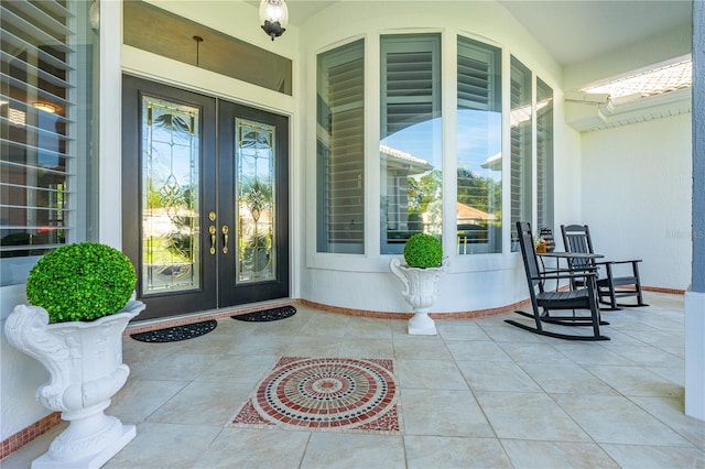 801 Arbor Glen Ct, Ormond Beach, FL 32174 - property entrance with french doors and a porch