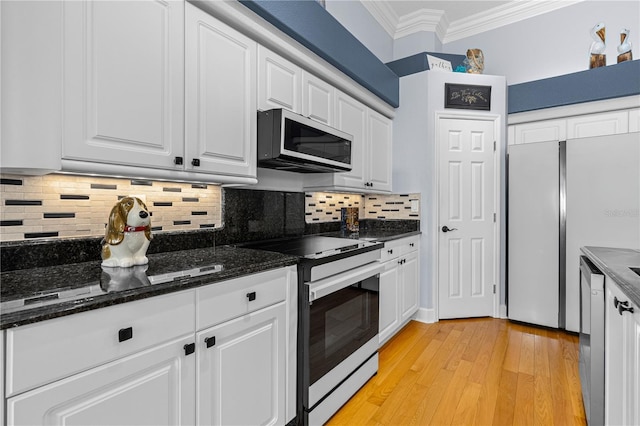 801 Arbor Glen Ct, Ormond Beach, FL 32174 - kitchen with white appliances, ornamental molding, white cabinetry, and decorative backsplash