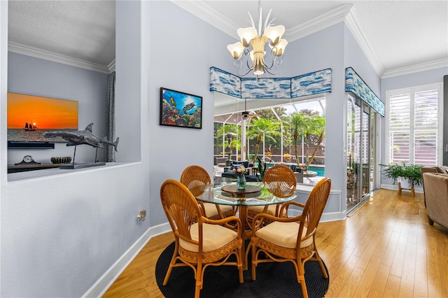 801 Arbor Glen Ct, Ormond Beach, FL 32174 - dining space featuring crown molding, hardwood / wood-style floors, and a chandelier