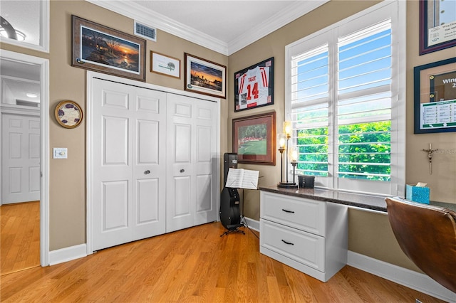 801 Arbor Glen Ct, Ormond Beach, FL 32174 - office area featuring built in study area, ornamental molding, and light wood-type flooring
