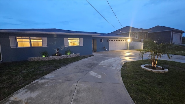 3510 Magnolia Way, Punta Gorda, FL 33950 - ranch-style home with concrete driveway, a front lawn, an attached garage, and stucco siding