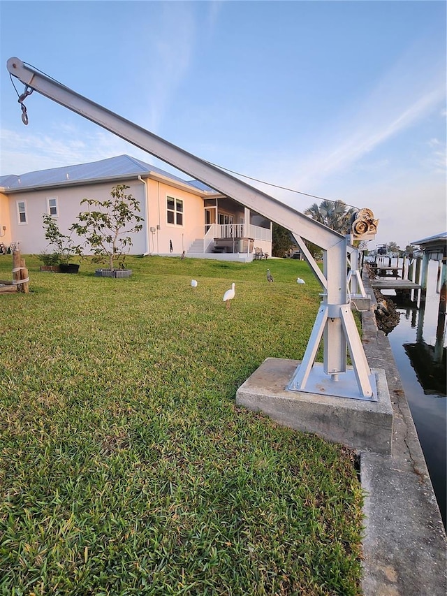 3510 Magnolia Way, Punta Gorda, FL 33950 - view of grassy yard with boat lift and a boat dock