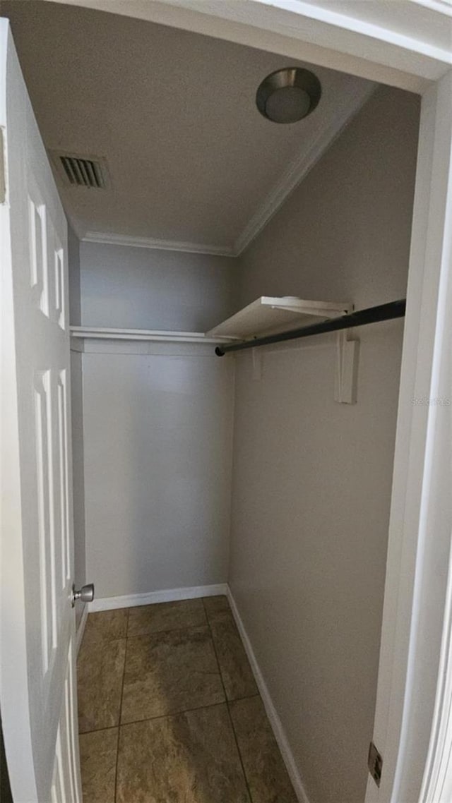 3510 Magnolia Way, Punta Gorda, FL 33950 - walk in closet with dark tile patterned floors