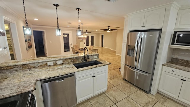3510 Magnolia Way, Punta Gorda, FL 33950 - kitchen featuring appliances with stainless steel finishes, crown molding, light tile patterned flooring, white cabinets, and light stone countertops