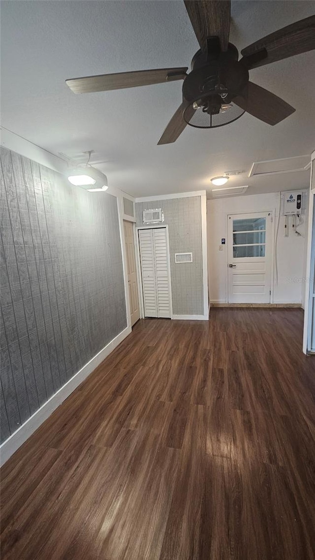 3510 Magnolia Way, Punta Gorda, FL 33950 - empty room featuring a ceiling fan, wood finished floors, and wood walls