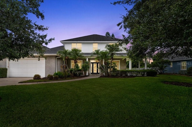 113 Neptune Ave, Ormond Beach, FL 32176 - view of front of house featuring an attached garage, a front lawn, and driveway