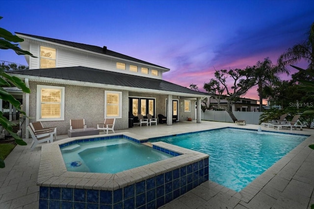 113 Neptune Ave, Ormond Beach, FL 32176 - view of swimming pool featuring a patio area, a pool with connected hot tub, and french doors