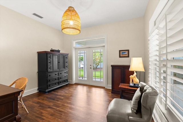 113 Neptune Ave, Ormond Beach, FL 32176 - sitting room with dark wood-type flooring and french doors