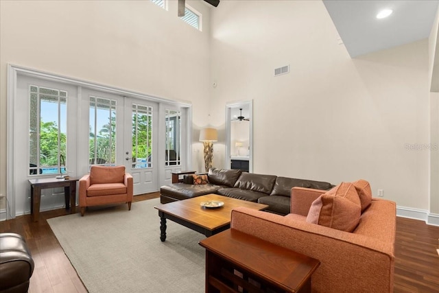 113 Neptune Ave, Ormond Beach, FL 32176 - living area featuring ceiling fan, french doors, a towering ceiling, and wood finished floors