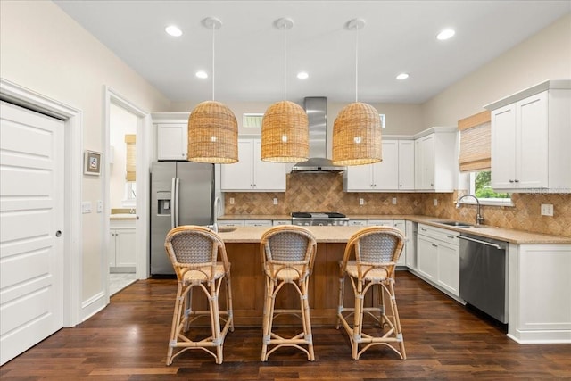 113 Neptune Ave, Ormond Beach, FL 32176 - kitchen featuring wall chimney range hood, stainless steel appliances, a kitchen island, decorative backsplash, and recessed lighting