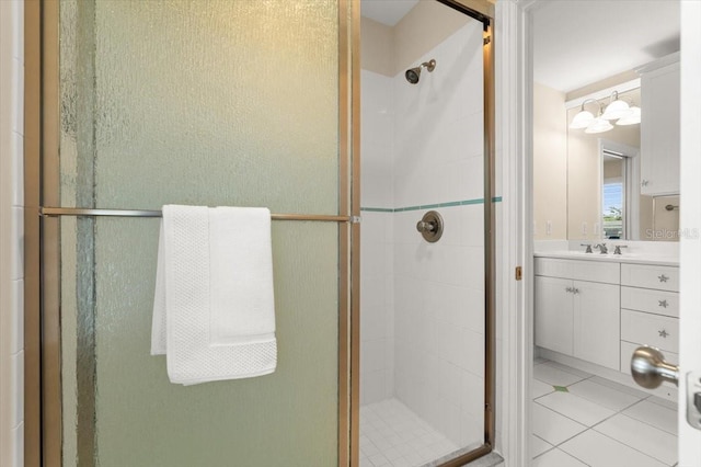 113 Neptune Ave, Ormond Beach, FL 32176 - bathroom featuring a stall shower, vanity, and tile patterned floors