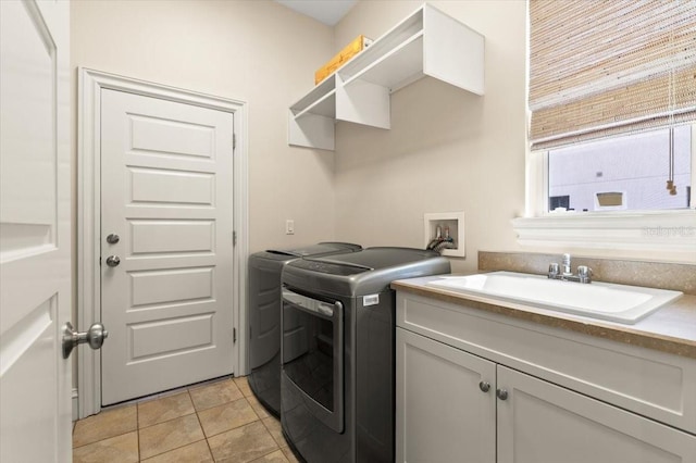 113 Neptune Ave, Ormond Beach, FL 32176 - laundry area with cabinet space, independent washer and dryer, and light tile patterned floors