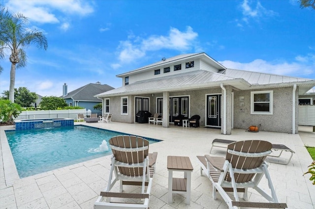 113 Neptune Ave, Ormond Beach, FL 32176 - view of swimming pool with a patio and a pool with connected hot tub