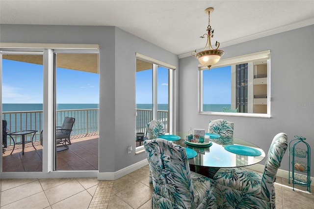 2901 S Atlantic Ave Unit 603, Daytona Beach Shores, FL 32118 - dining area with a water view and tile patterned floors