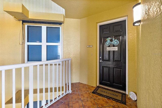 2901 S Atlantic Ave Unit 603, Daytona Beach Shores, FL 32118 - doorway to property featuring stucco siding and a porch