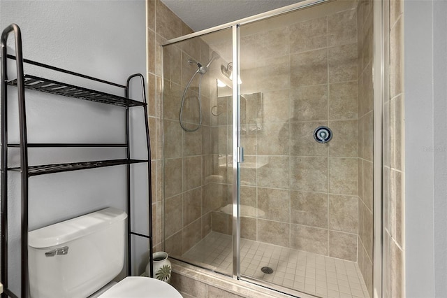 2901 S Atlantic Ave Unit 603, Daytona Beach Shores, FL 32118 - bathroom featuring toilet and a stall shower