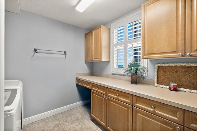 2901 S Atlantic Ave Unit 603, Daytona Beach Shores, FL 32118 - laundry room featuring cabinet space, separate washer and dryer, and light tile patterned floors