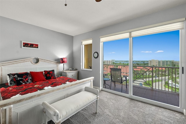 2901 S Atlantic Ave Unit 603, Daytona Beach Shores, FL 32118 - bedroom featuring access to exterior, carpet floors, and multiple windows