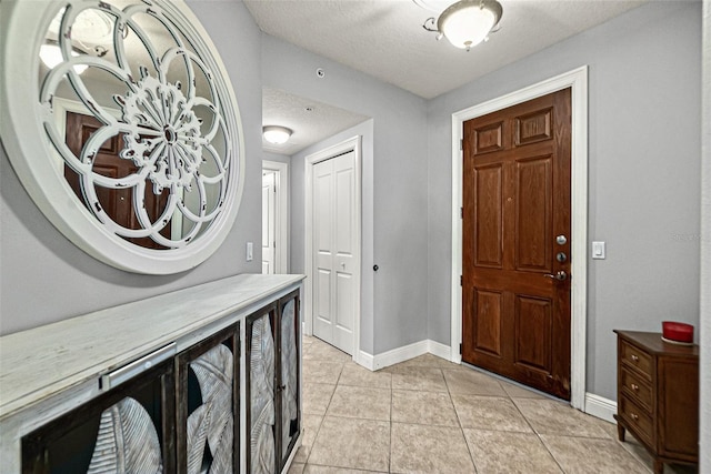 2901 S Atlantic Ave Unit 603, Daytona Beach Shores, FL 32118 - foyer entrance with light tile patterned floors and a textured ceiling