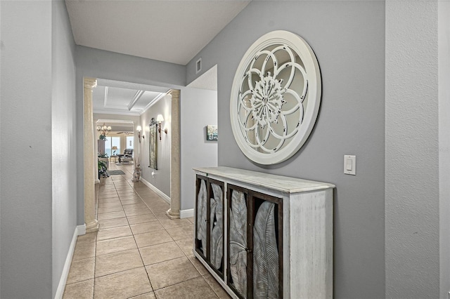 2901 S Atlantic Ave Unit 603, Daytona Beach Shores, FL 32118 - corridor featuring light tile patterned floors, crown molding, and decorative columns
