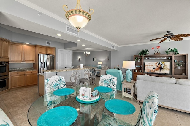 2901 S Atlantic Ave Unit 603, Daytona Beach Shores, FL 32118 - dining space with ornamental molding, light tile patterned floors, a chandelier, a ceiling fan, and recessed lighting
