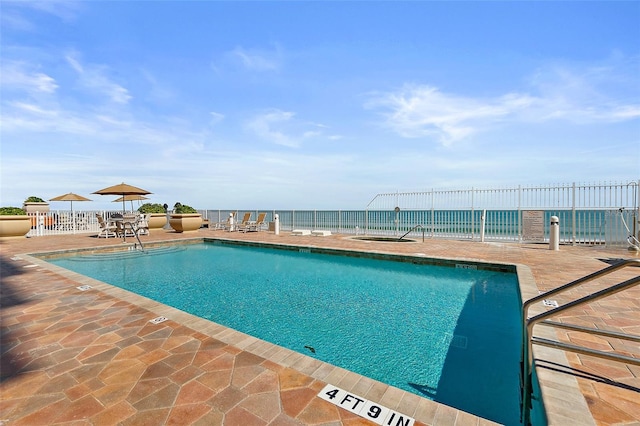 2901 S Atlantic Ave Unit 603, Daytona Beach Shores, FL 32118 - community pool featuring a patio