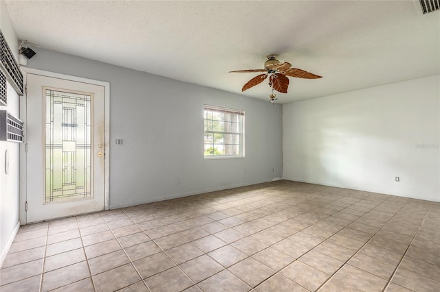 1624 Queen Palm Dr, Edgewater, FL 32132 - unfurnished room with a ceiling fan, a textured ceiling, and light tile patterned floors