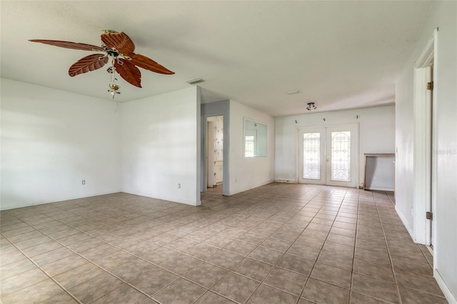 1624 Queen Palm Dr, Edgewater, FL 32132 - tiled spare room with ceiling fan and french doors