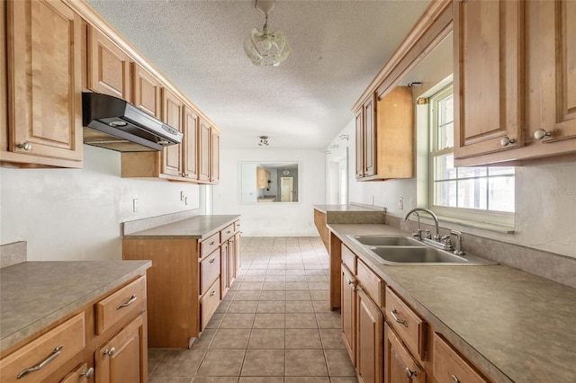 1624 Queen Palm Dr, Edgewater, FL 32132 - kitchen featuring under cabinet range hood, a textured ceiling, and light tile patterned floors