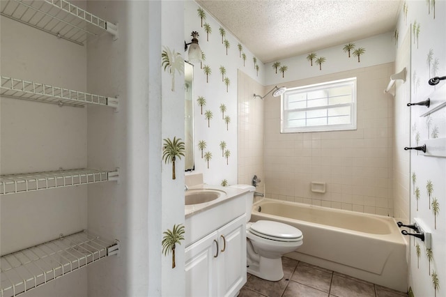 1624 Queen Palm Dr, Edgewater, FL 32132 - bathroom with vanity, bathing tub / shower combination, a textured ceiling, and tile patterned floors