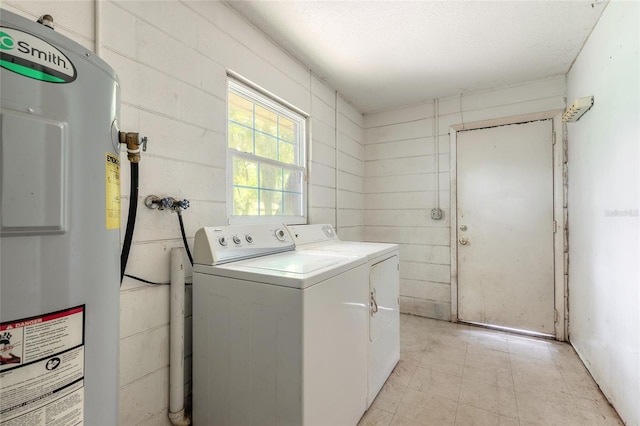 1624 Queen Palm Dr, Edgewater, FL 32132 - laundry area featuring water heater, washer and dryer, and a textured ceiling