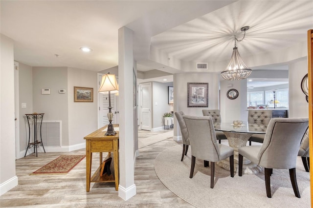 1 John Anderson Dr Unit 1030, Ormond Beach, FL 32176 - dining area featuring a chandelier, light wood-style floors, and recessed lighting