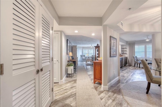 1 John Anderson Dr Unit 1030, Ormond Beach, FL 32176 - hallway with healthy amount of natural light, light wood-style floors, and recessed lighting