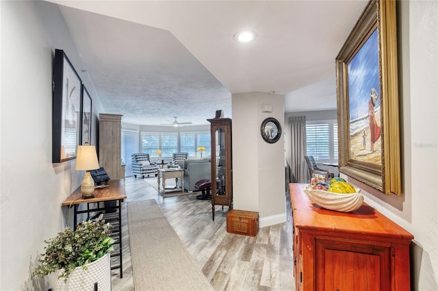 1 John Anderson Dr Unit 1030, Ormond Beach, FL 32176 - hallway with light wood finished floors, wine cooler, plenty of natural light, and recessed lighting