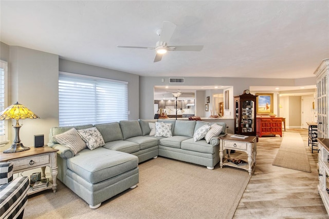 1 John Anderson Dr Unit 1030, Ormond Beach, FL 32176 - living room with a ceiling fan and light wood-type flooring