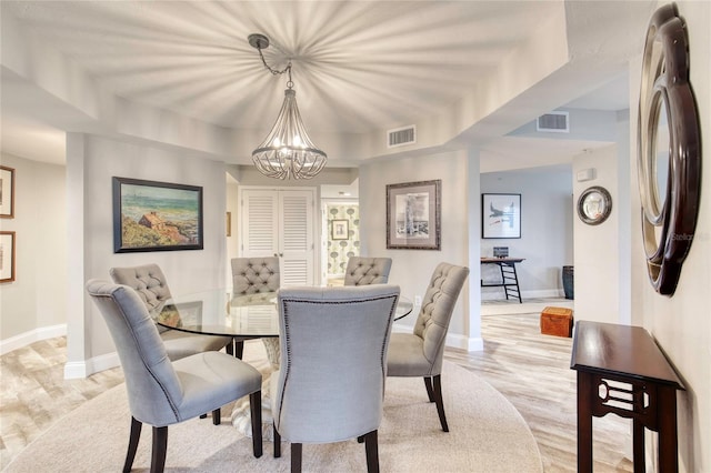 1 John Anderson Dr Unit 1030, Ormond Beach, FL 32176 - dining space with a chandelier and light wood-type flooring
