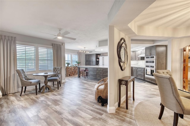 1 John Anderson Dr Unit 1030, Ormond Beach, FL 32176 - dining area with light wood-style floors and ceiling fan