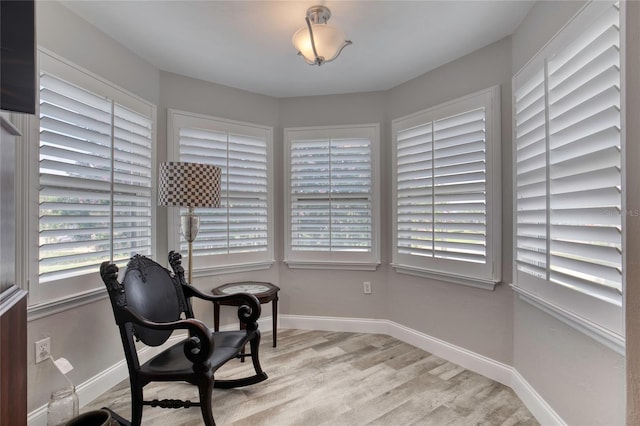 1 John Anderson Dr Unit 1030, Ormond Beach, FL 32176 - sitting room with wood finished floors and plenty of natural light