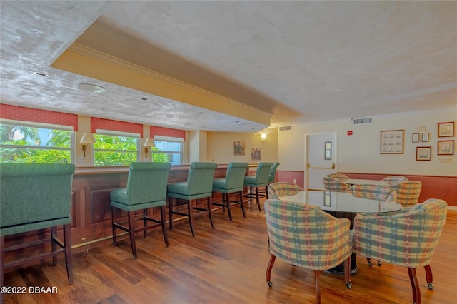 1 John Anderson Dr Unit 1030, Ormond Beach, FL 32176 - dining area with wood finished floors, ornamental molding, and wainscoting