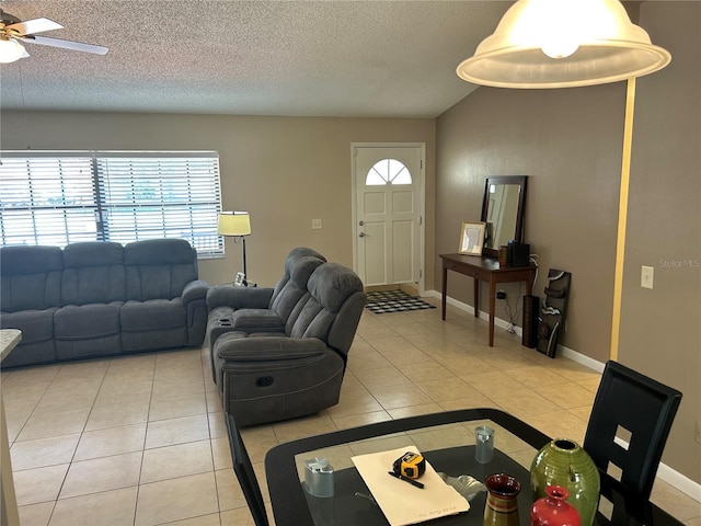879 S Hancock Dr, Deltona, FL 32725 - living area with ceiling fan, light tile patterned floors, and a textured ceiling