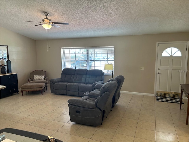 879 S Hancock Dr, Deltona, FL 32725 - living room featuring light tile patterned floors, a ceiling fan, and a textured ceiling