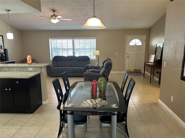 879 S Hancock Dr, Deltona, FL 32725 - dining area featuring light tile patterned flooring, a ceiling fan, and a textured ceiling