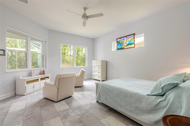2816 E Venetian Lake Cir, New Smyrna Beach, FL 32168 - bedroom with baseboards and ceiling fan