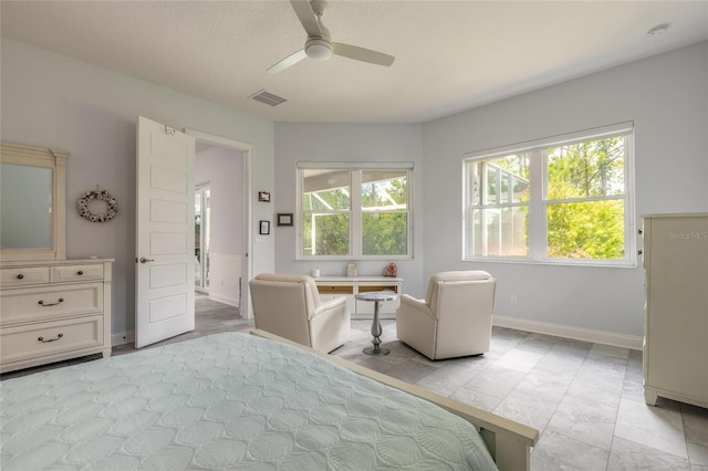2816 E Venetian Lake Cir, New Smyrna Beach, FL 32168 - bedroom featuring ceiling fan and baseboards