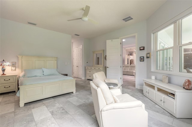 2816 E Venetian Lake Cir, New Smyrna Beach, FL 32168 - bedroom with a ceiling fan and a closet