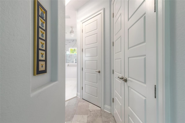 2816 E Venetian Lake Cir, New Smyrna Beach, FL 32168 - corridor featuring baseboards