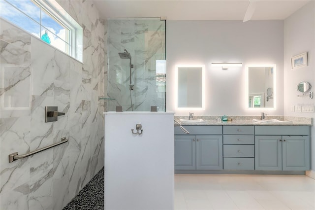 2816 E Venetian Lake Cir, New Smyrna Beach, FL 32168 - bathroom featuring double vanity and a marble finish shower