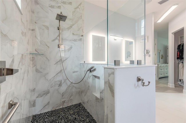 2816 E Venetian Lake Cir, New Smyrna Beach, FL 32168 - bathroom featuring a marble finish shower and vanity
