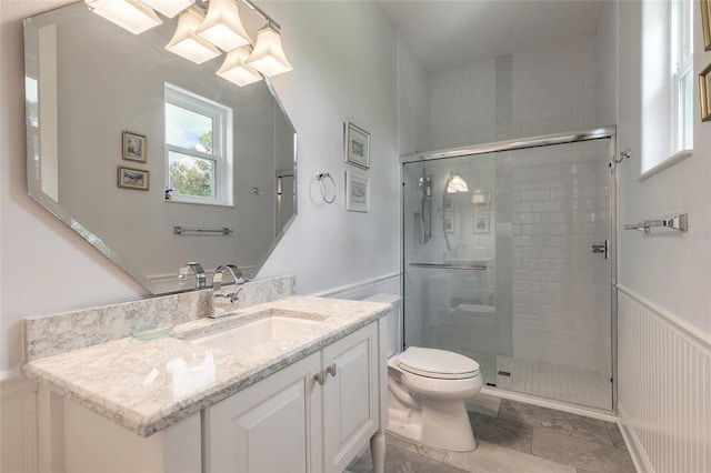2816 E Venetian Lake Cir, New Smyrna Beach, FL 32168 - bathroom with vanity, a stall shower, and wainscoting